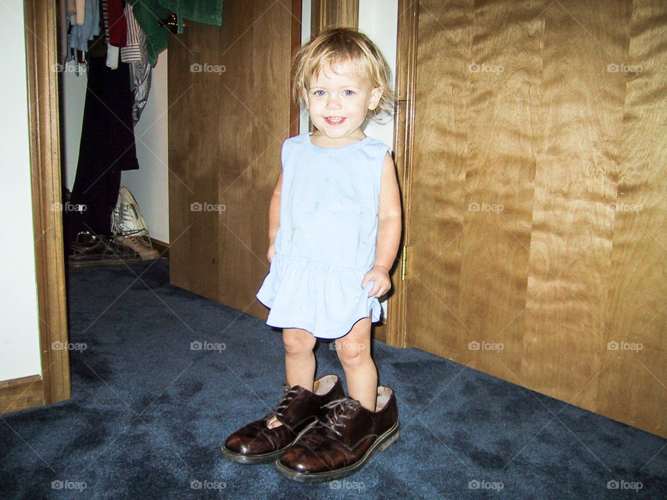 Big Shoes to Fill- daughter walking in Daddy’s shoes.