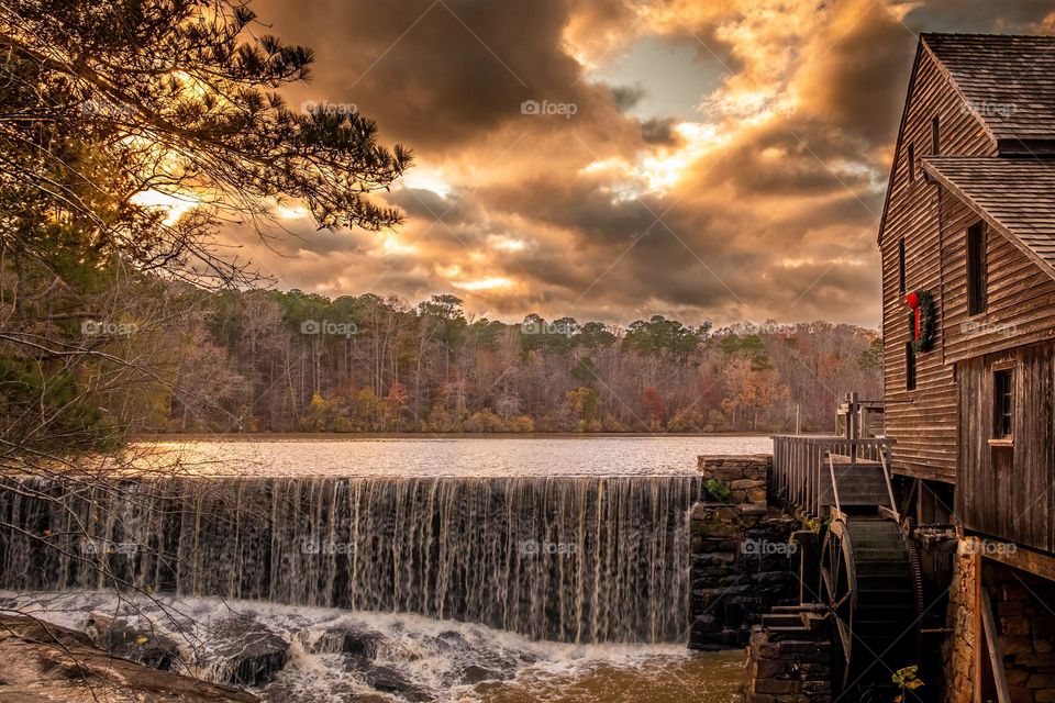 Dramatic clouds set the mood at the old mill. Historic Yates Mill County Park, Raleigh, North Carolina. 