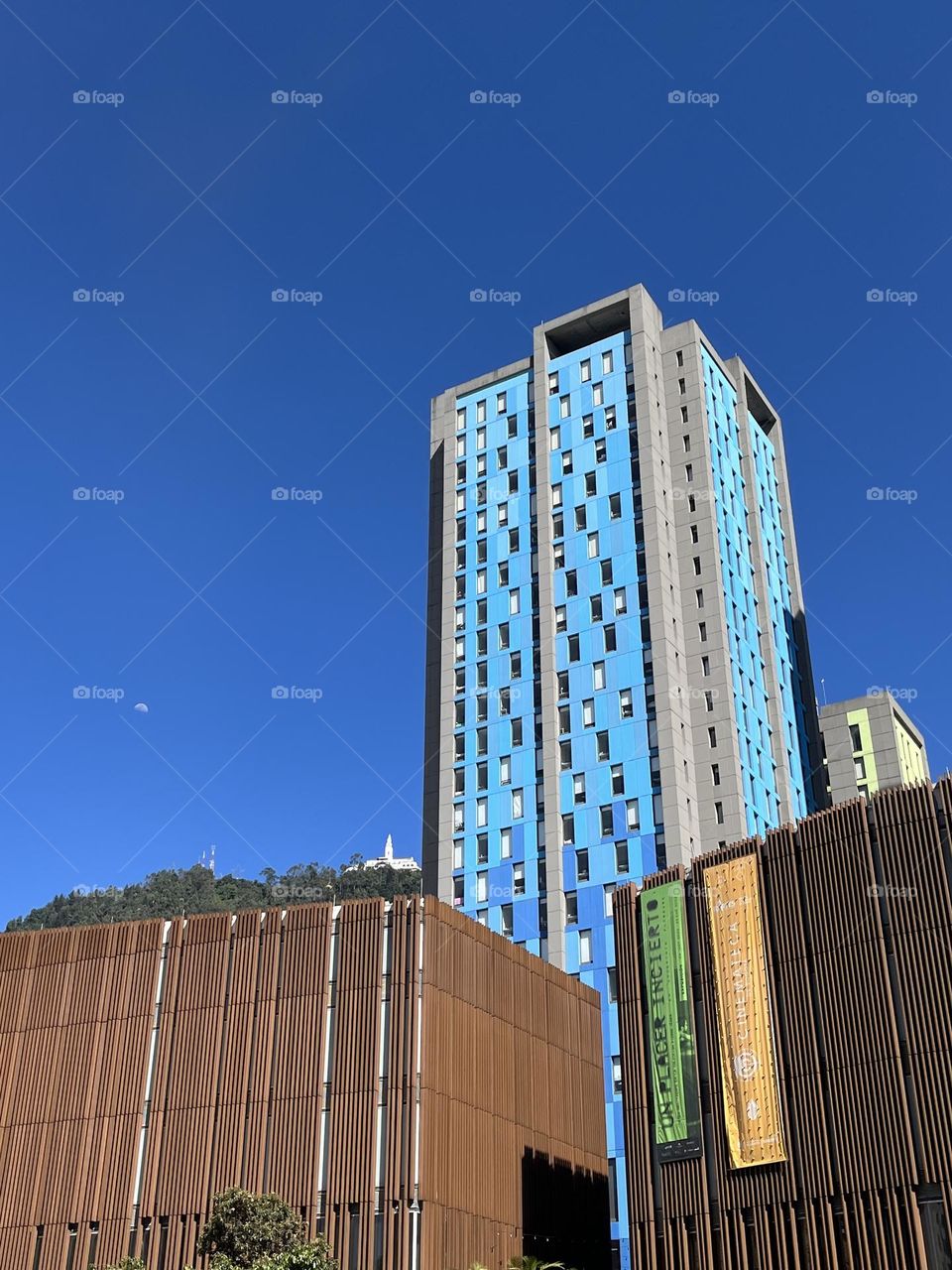 A beautiful day seeing the church on te mountain behind the building 