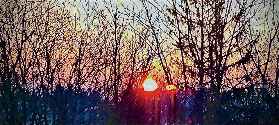Thru a trick of perception the image of the fiery rising sun is mirrored and somehow doubled. Is also the energy we get from the sun doubled or does the doubling take place entirely in our perception of the World. 2023. Hypnotic Productions