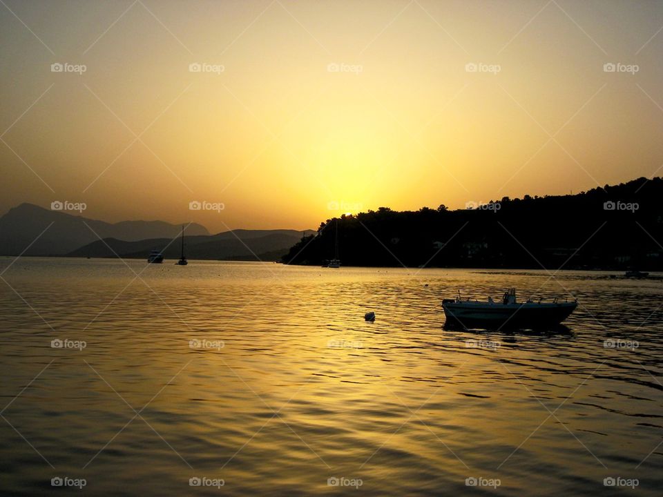 Scenic view of lake at sunset