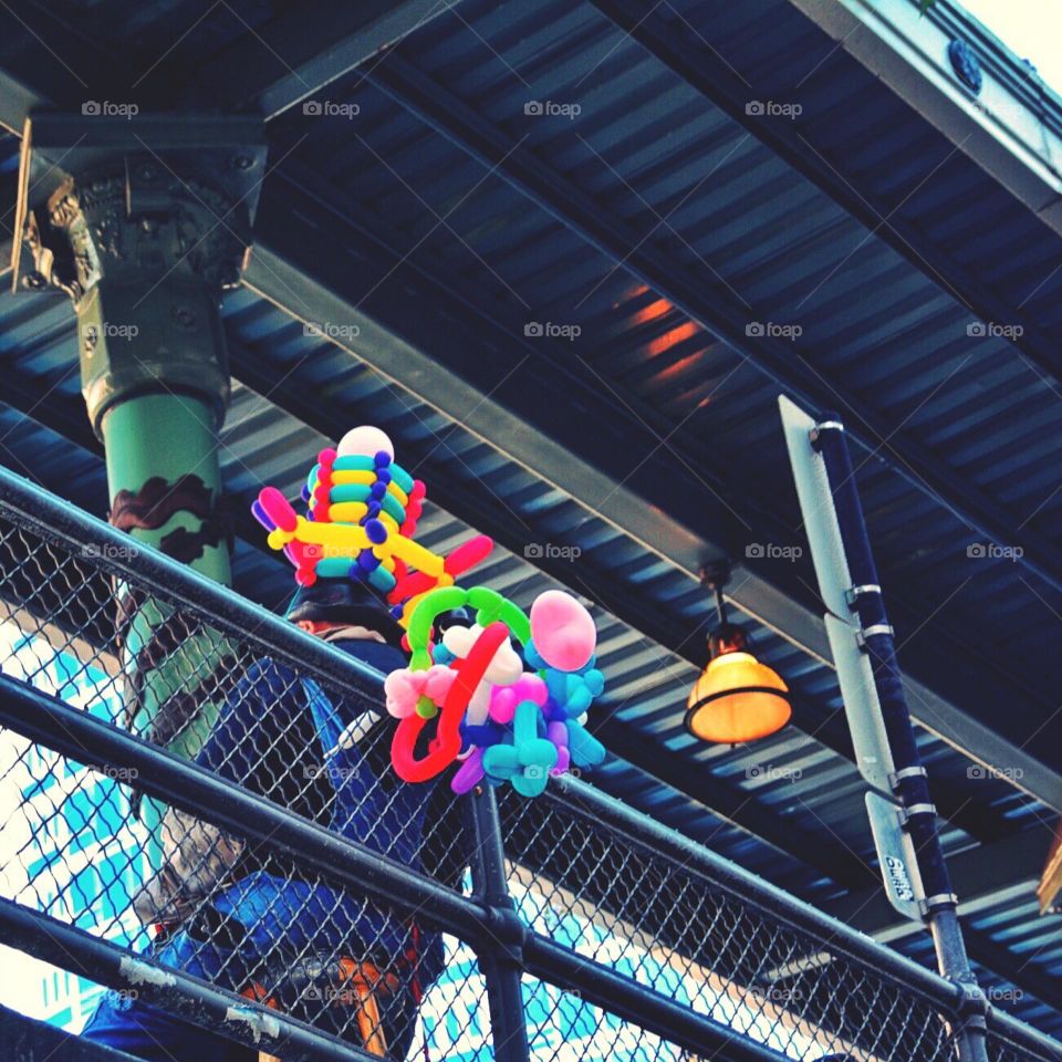 Man selling balloon art