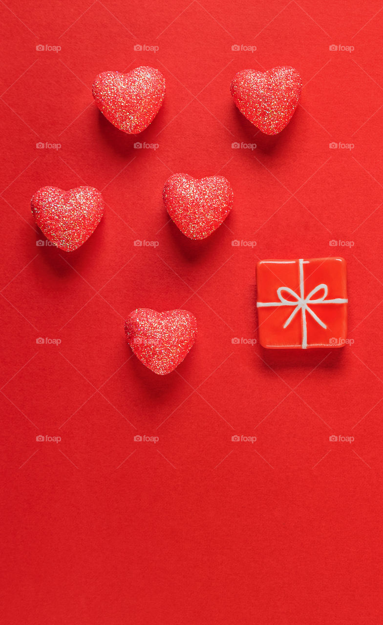 Red hearts on a red background. Valentine's Day.