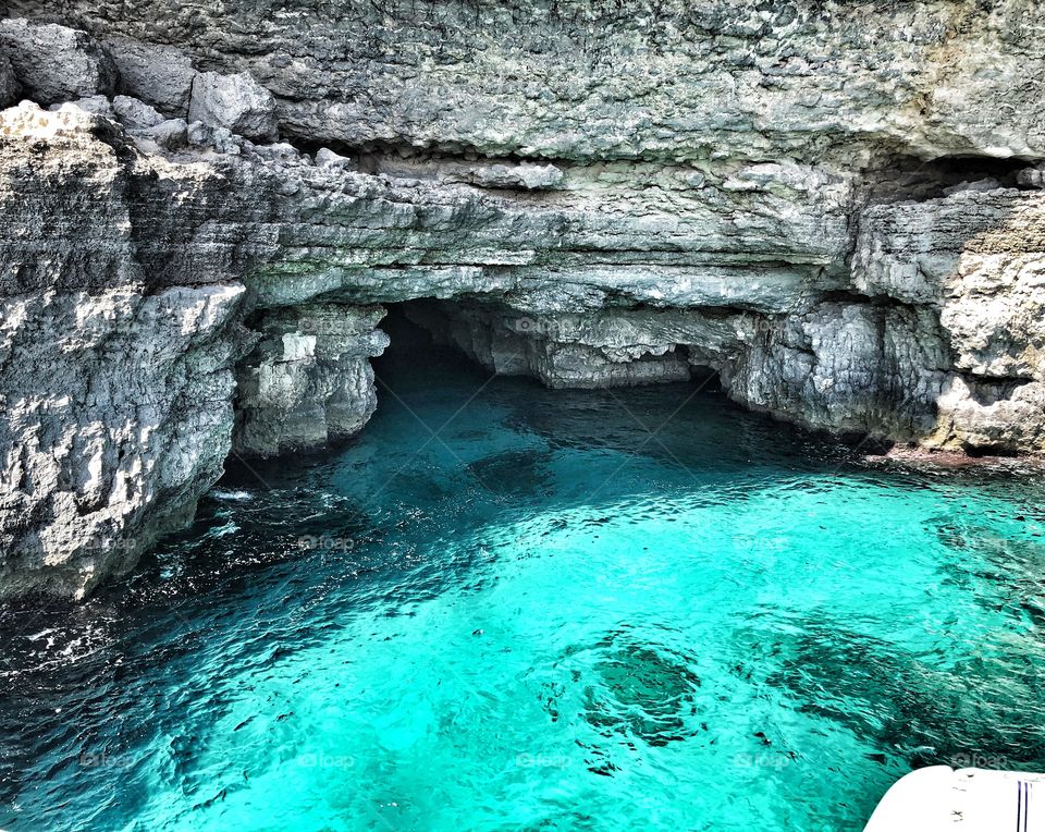 Caves round Malta, clear turquoise sea
