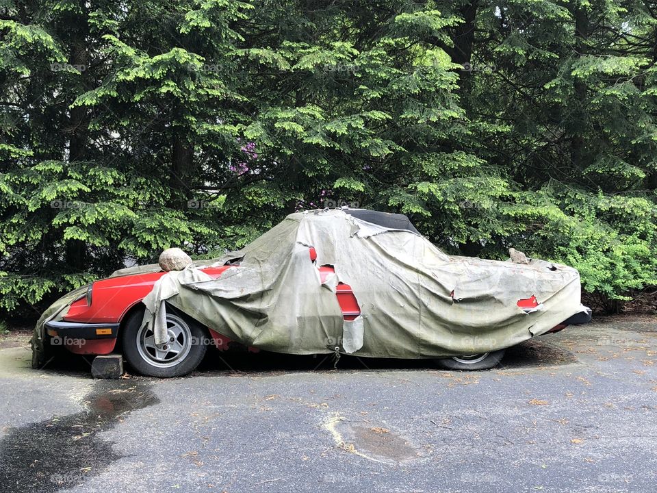 Junker car with beat up canvas cover