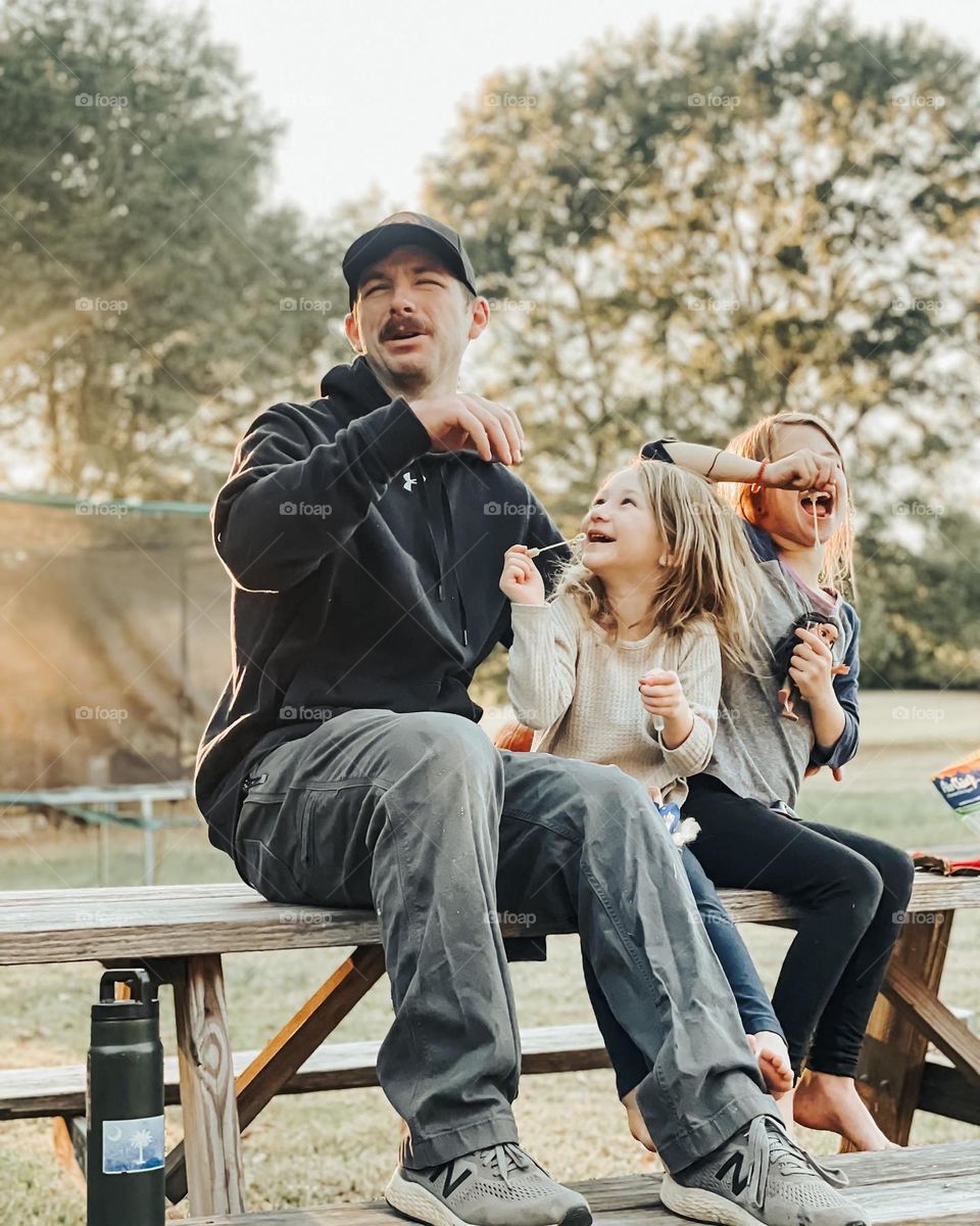 Funny daddy with daughters