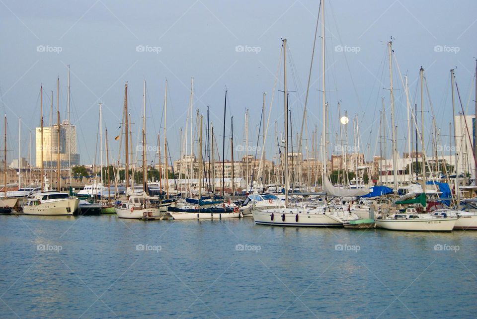marina in the late afternoon with a full moon