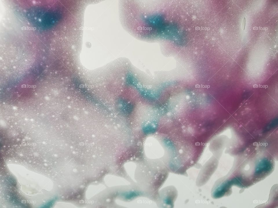 At the car wash - A rush of colored soap against the windshield.