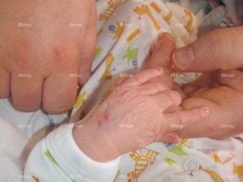 New born hand holding. Brand new baby holding mom's hand 