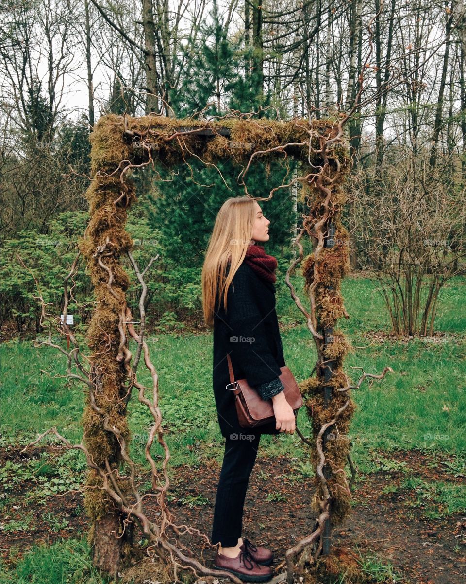 Woman standing tree frame