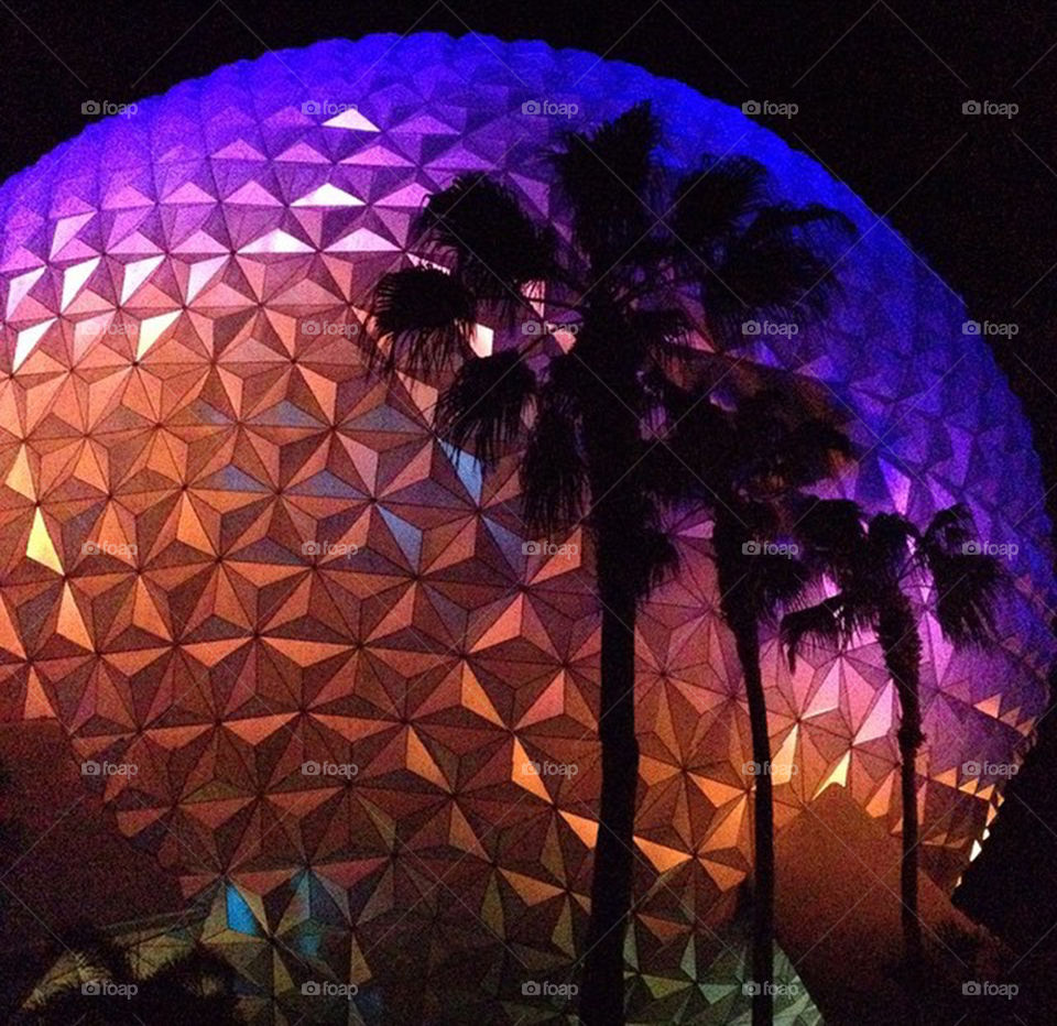 At Ball at Epcot in Disney. Photo at night in June of the Epcot Ball in Walt Disney World all lit up.
