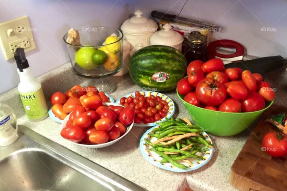 Bountiful crop. Vegetables grown in garden at home , pickle cucumbers , tomatoes and more!