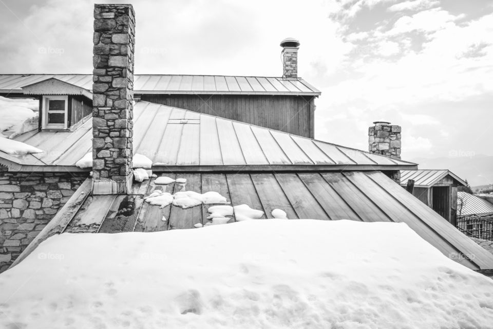 Snowy Roof Cabin In Winter
