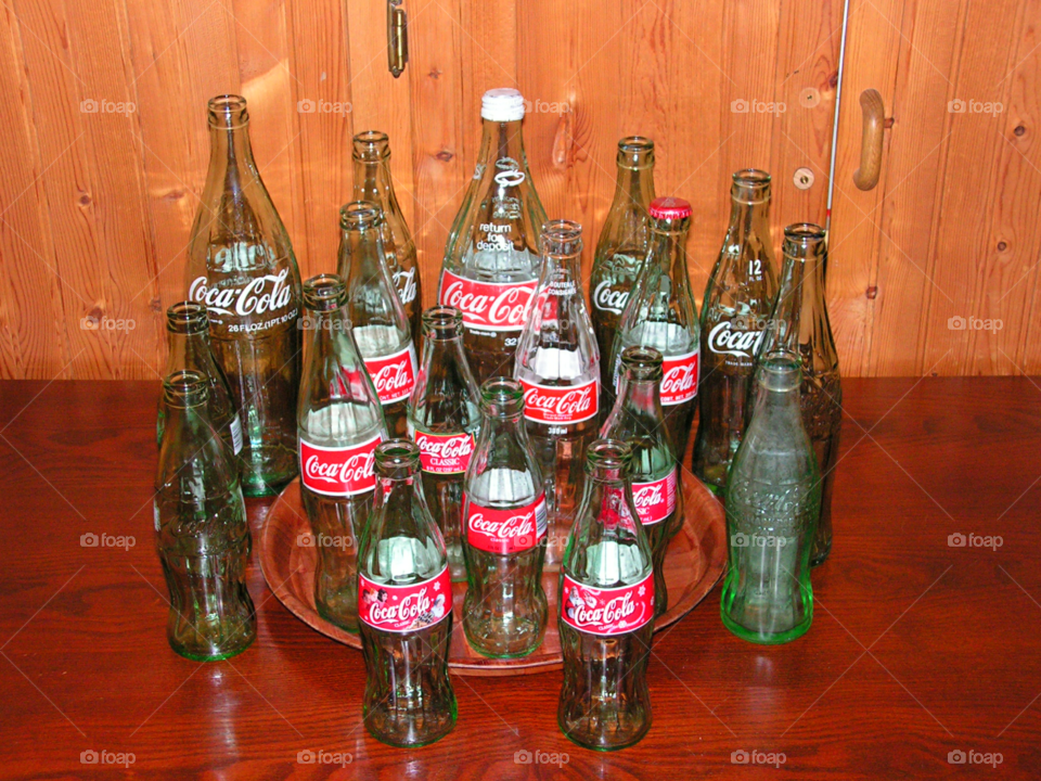 Coke-Cola bottles antique and new logo including Christmas designs