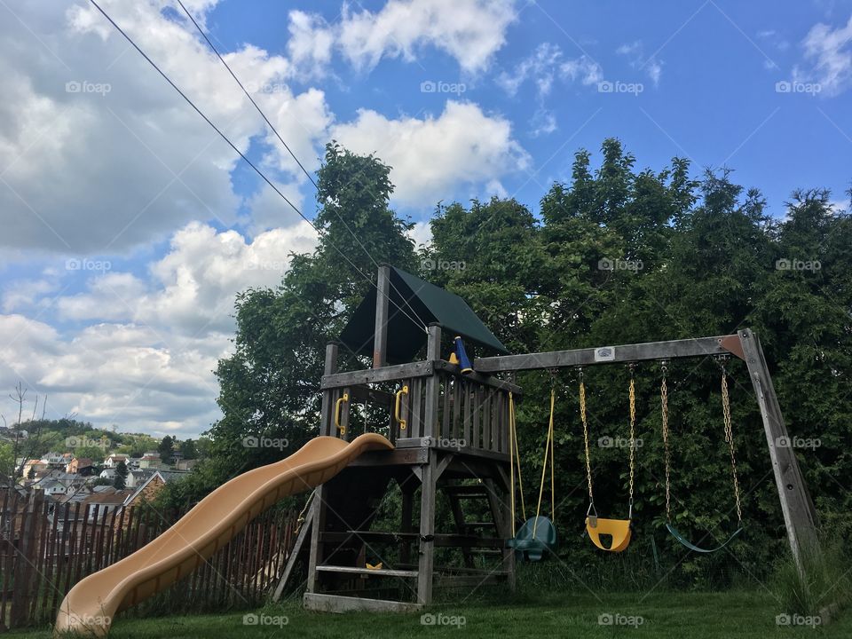 Kids play set, slide and swings. 