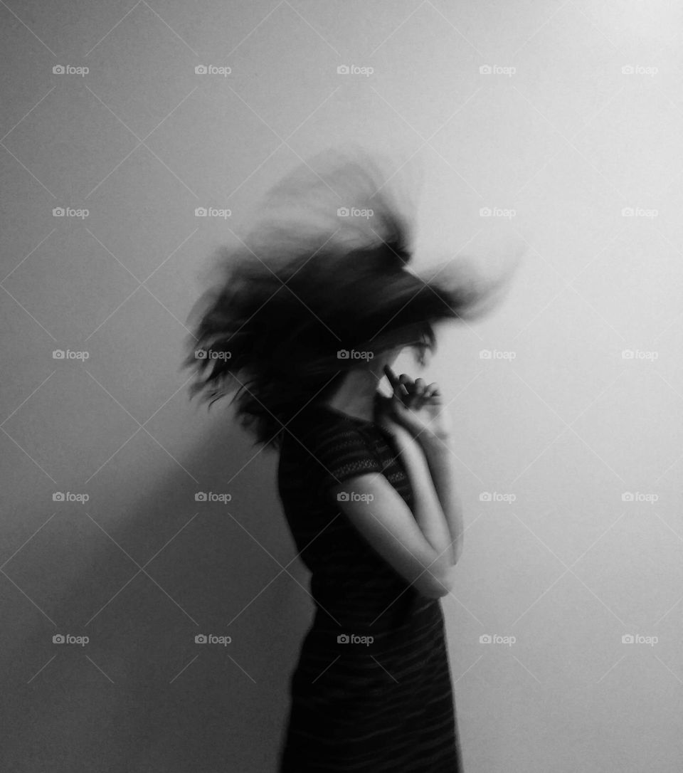 Black and white portrait. Hair motion