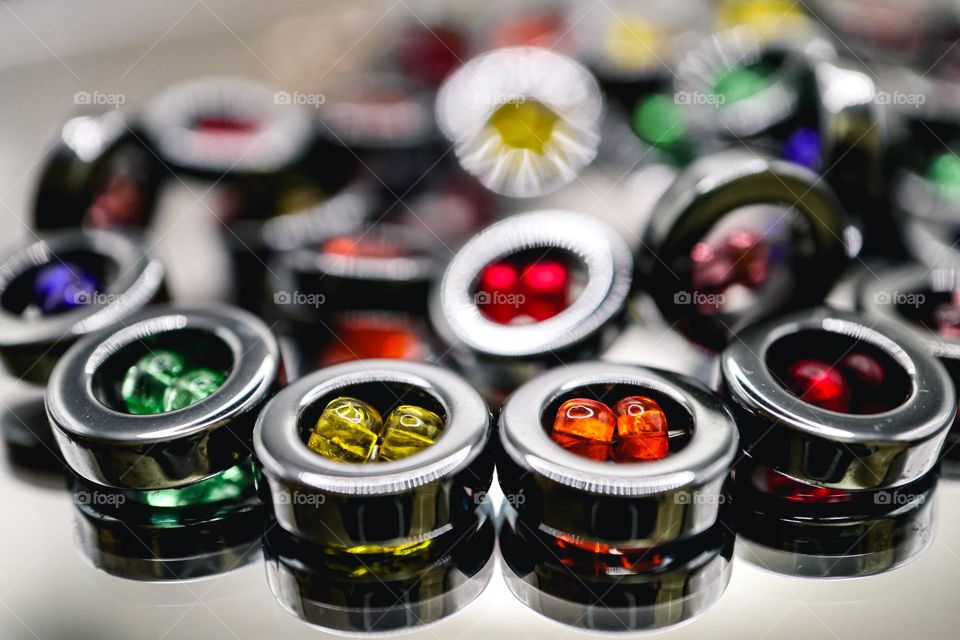 Hematite necklace with multicolored beads Pride rainbow necklace circular hematite beads reflecting on a mirror 