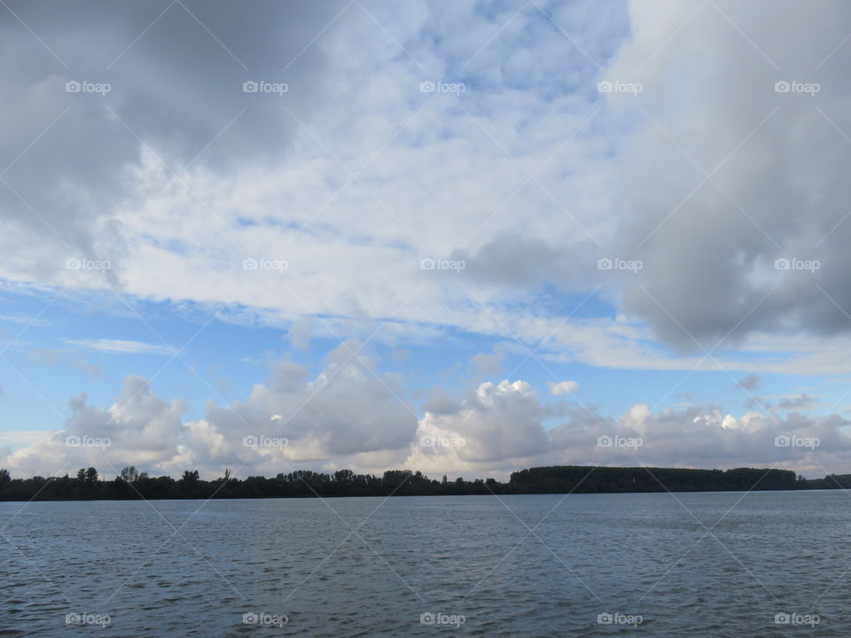 Cloudy sky over the River taken From the shore