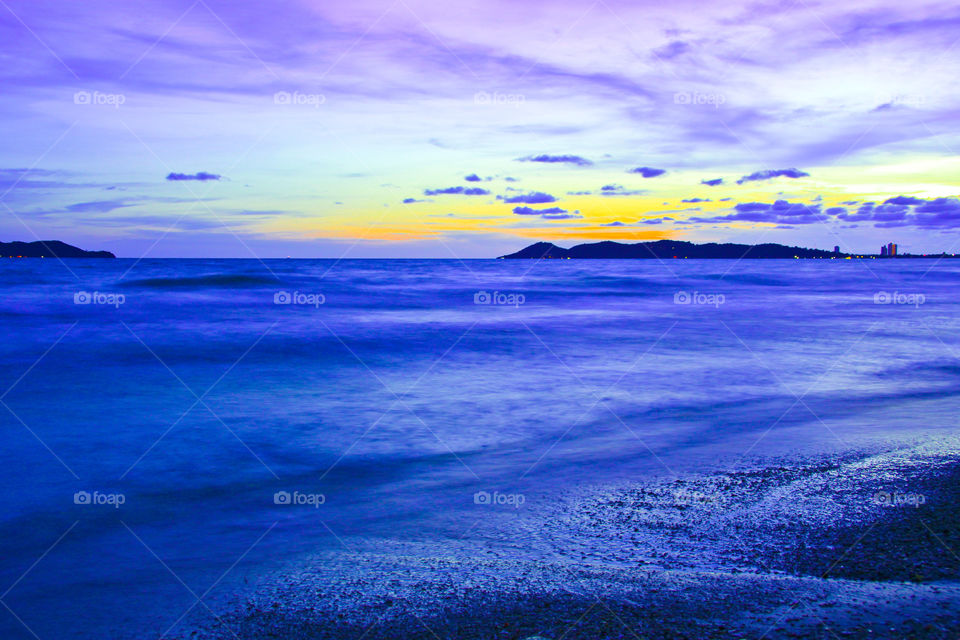 Sunset in evening on the beach.