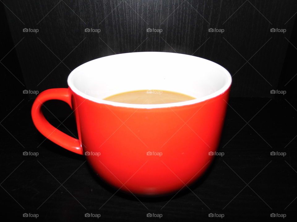 Red coffee mug on the table