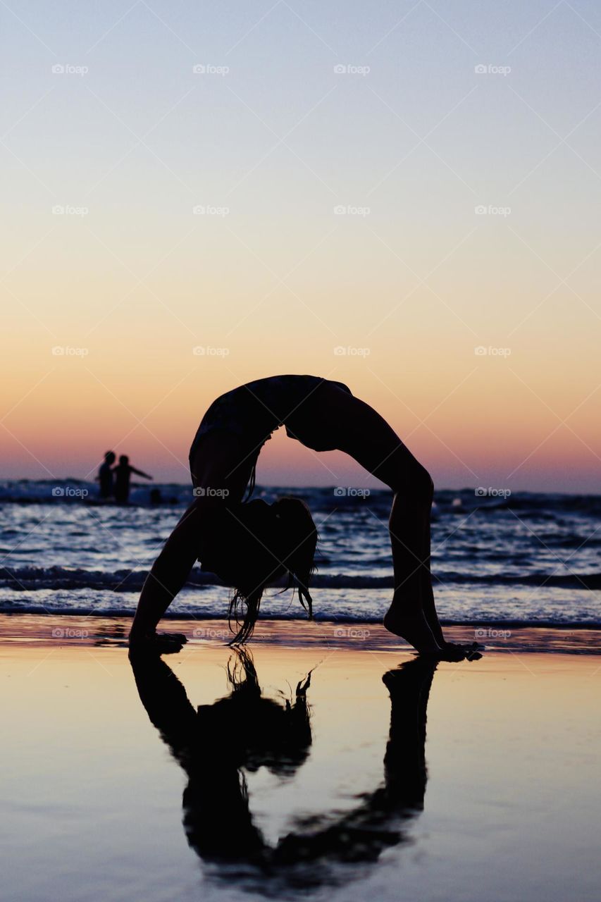Gymnastic girl during sunset 