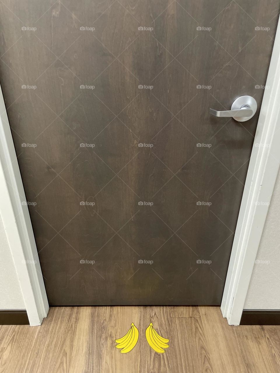 Outside of a door at Pediatric’s office, funny bananas on floor of Pediatrics office, decorating for children, bananas on the floor