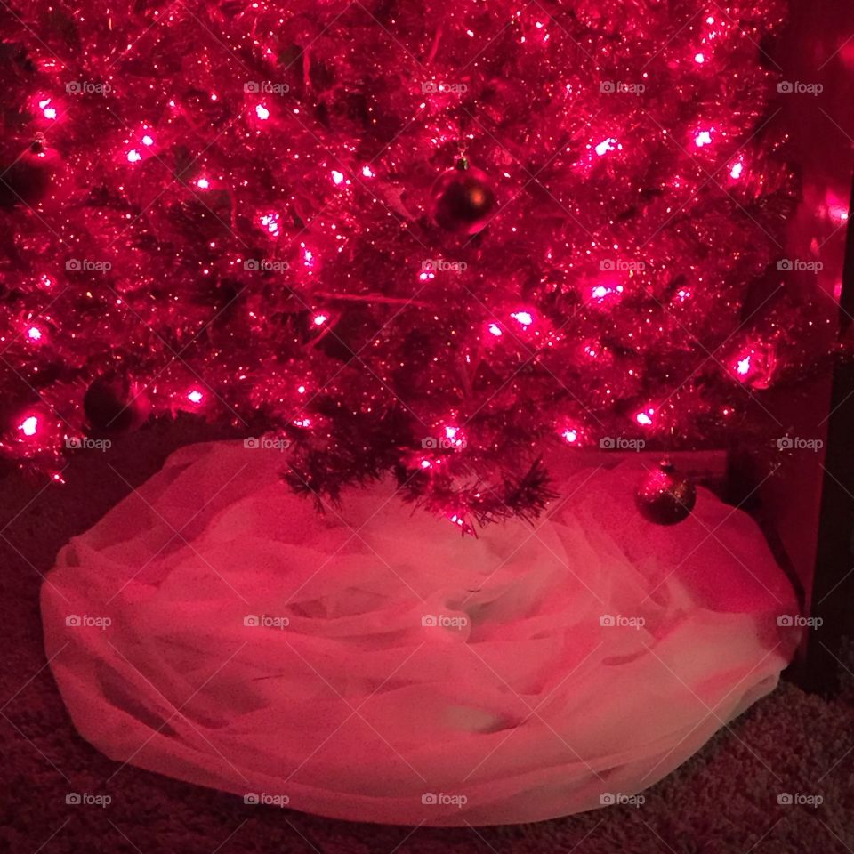 Red Christmas tree with snowy white skirt