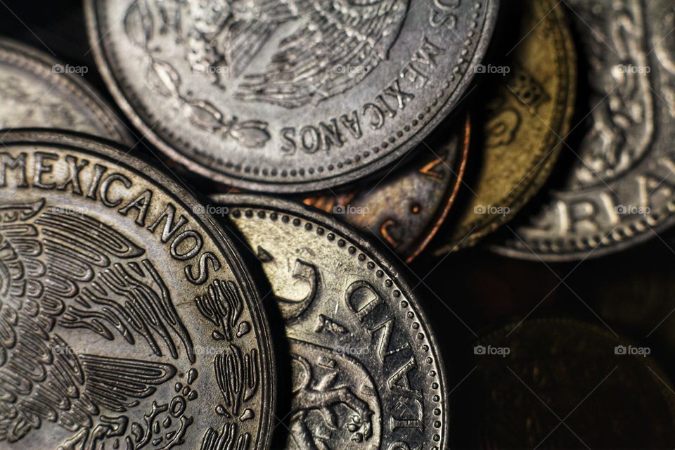 close up of small coins. mixed countries