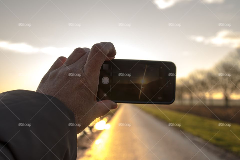 Taking a picture with my mobile of the stunning sunrise