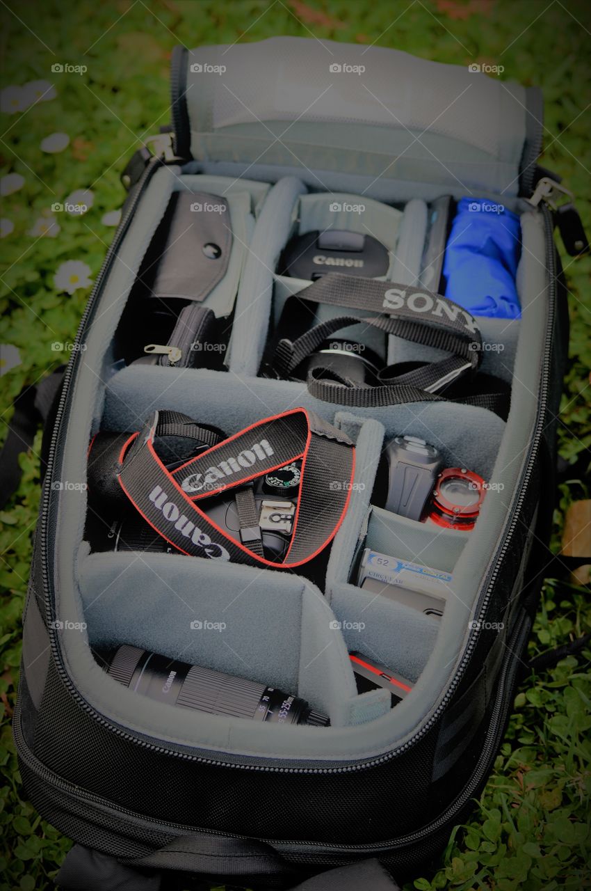 photography bag full of wonderful technology, Canon t5 camera, Sony PowerShot camera, Canon zoom lens, underwater camera, Canon wide-angle lens