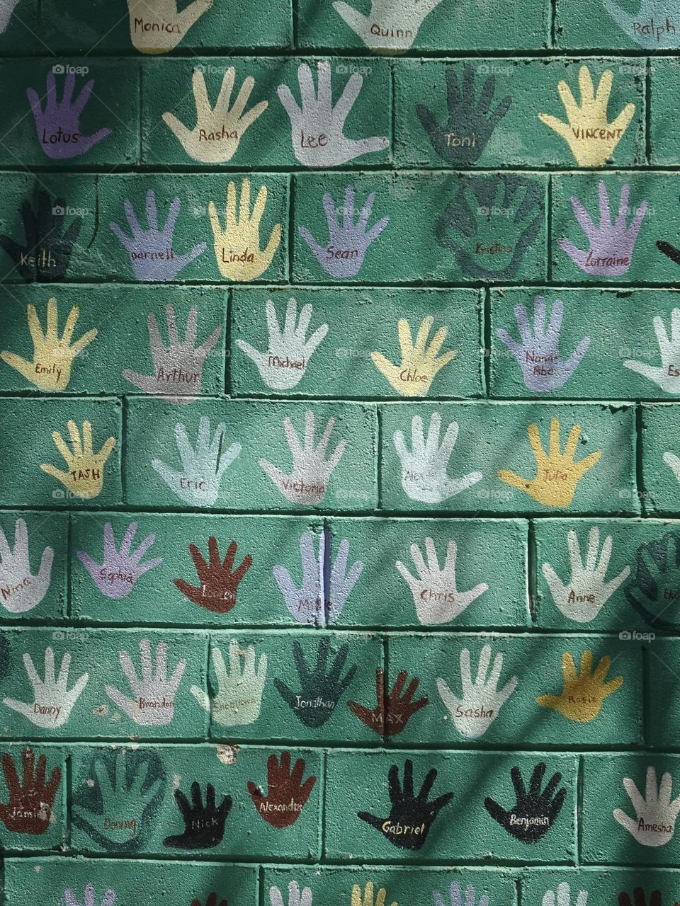 Hands and names on the wall