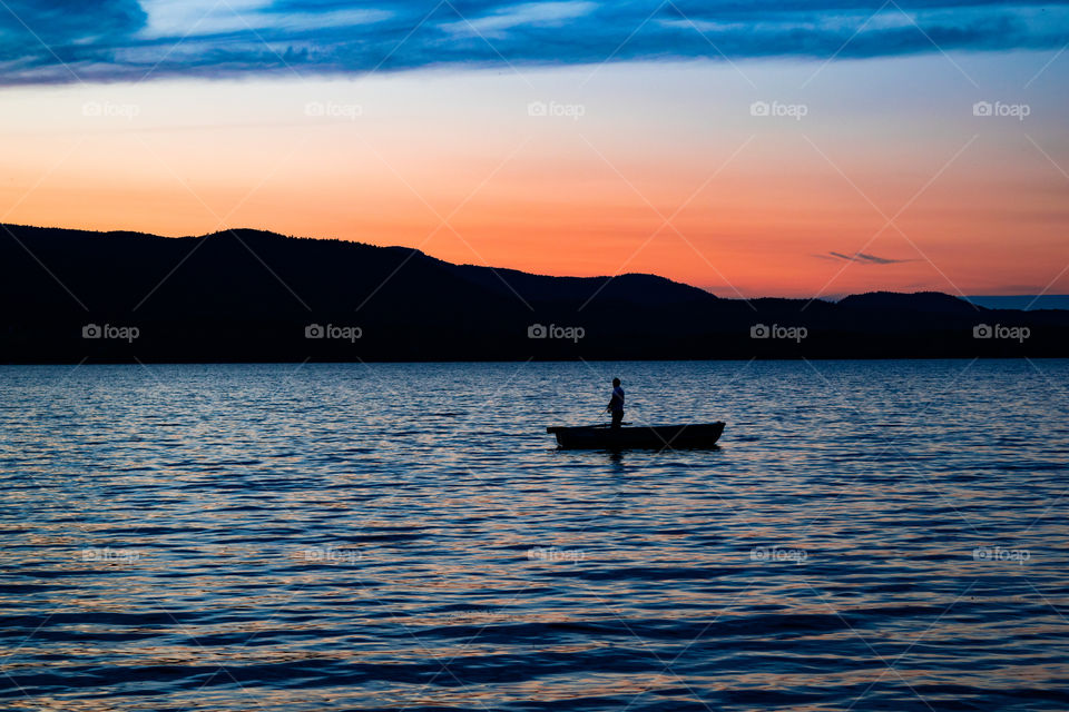Silhouette of a person in boat