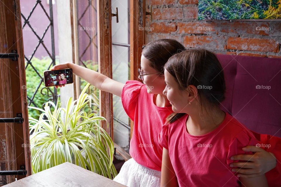 Two girls making selfie