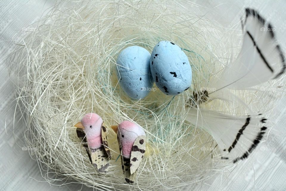 Easter spring holiday decorative birds with eggs in nest