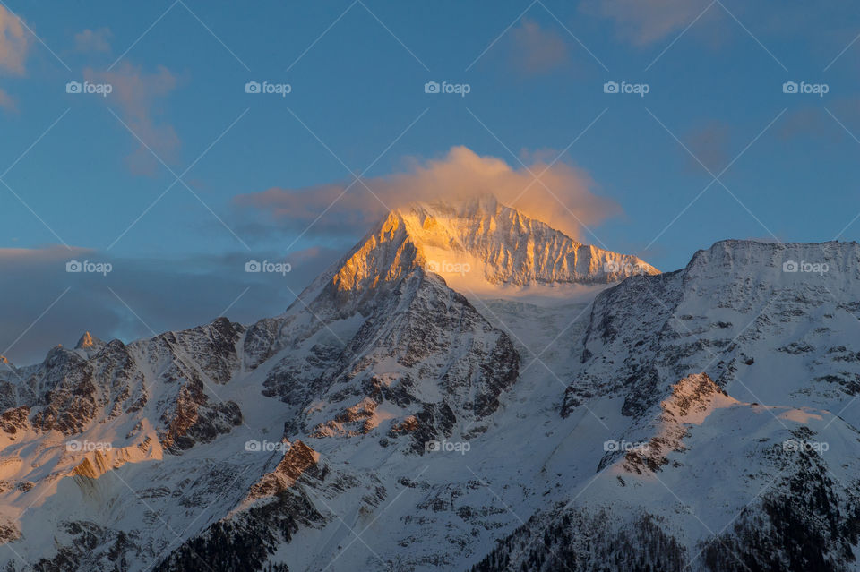 mountain peak in the sunset 
