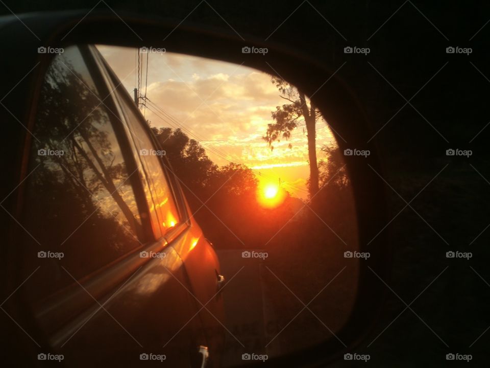 Sunset in the car mirror. Bento Gonçalves,  RS,  Brasil.