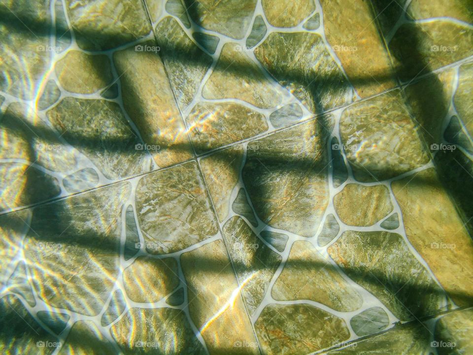 floor textures, water reflections, and shadows from the hot springs