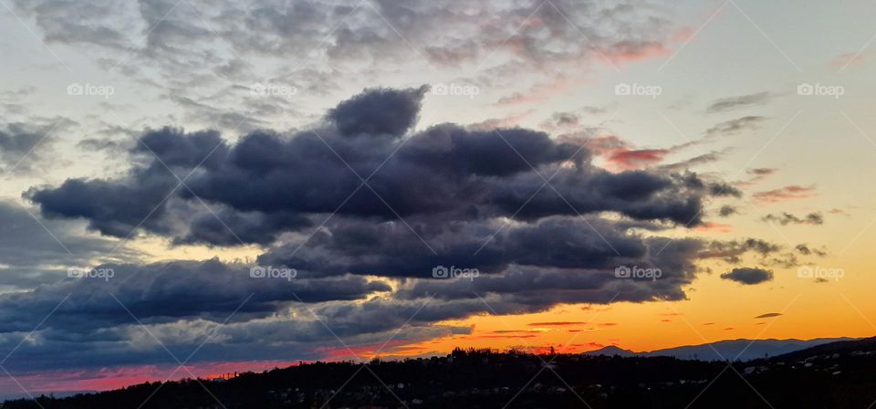 Red and orange sky above the city
