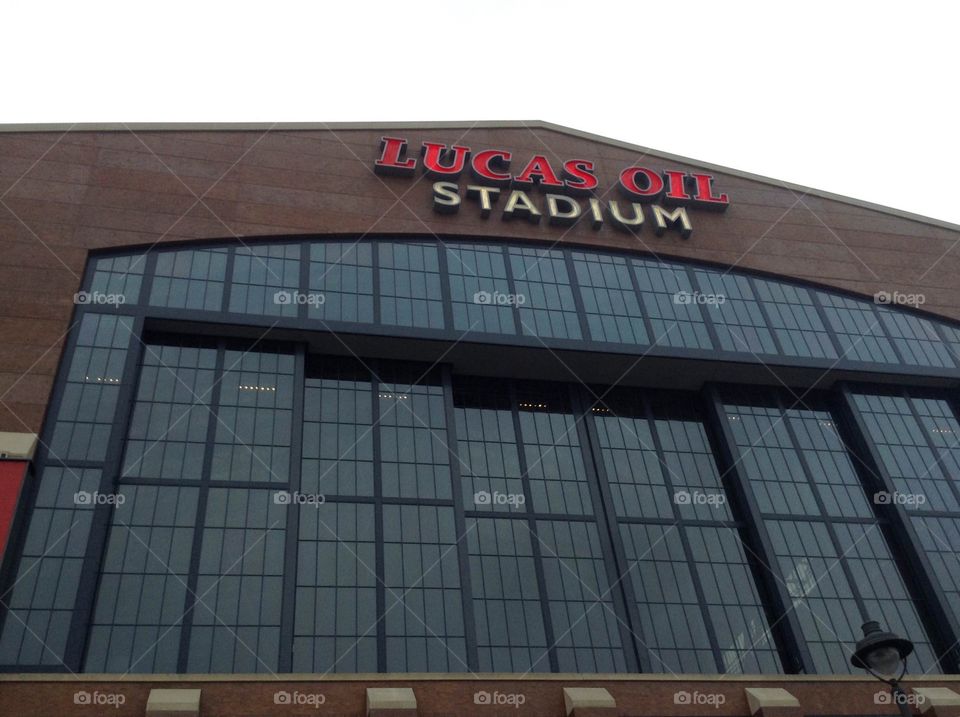 A photo looking up at the front of Lucas oil stadium.