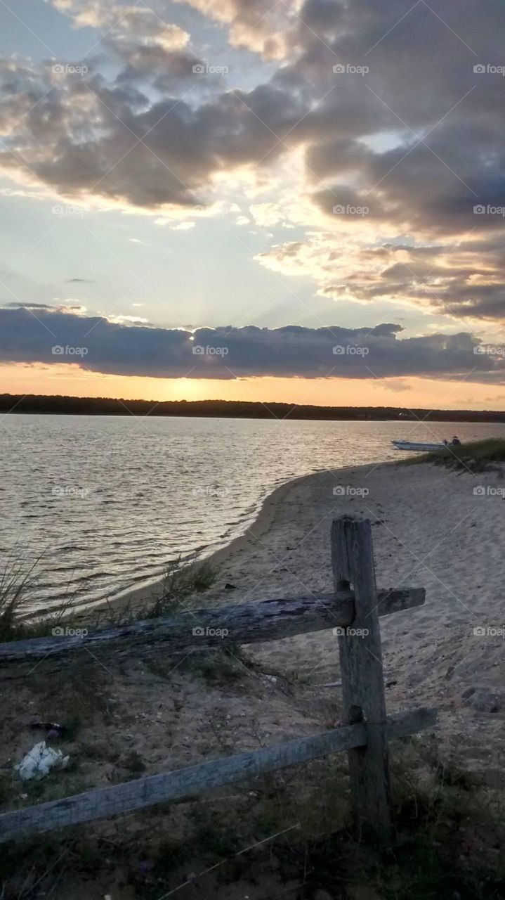 This is serenity, for me, and more. The absolute beauty of the dimming light contrasting the distant landmass is, in my mind, spectacular.