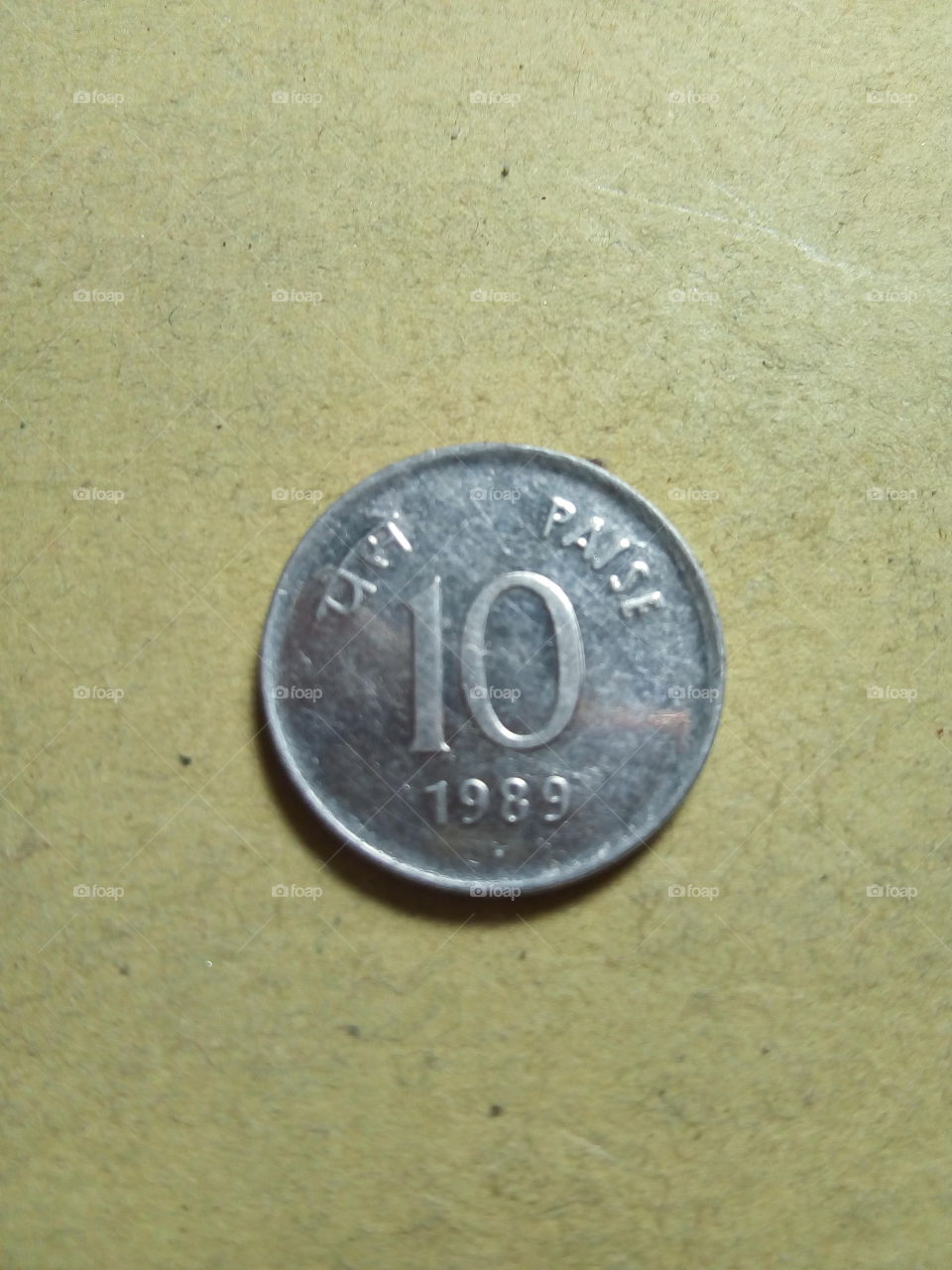 Ten paise- 1/10 share of Indian Rupee issued by Government of India in 1989.