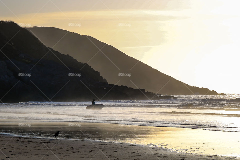 Surfer at sunrise