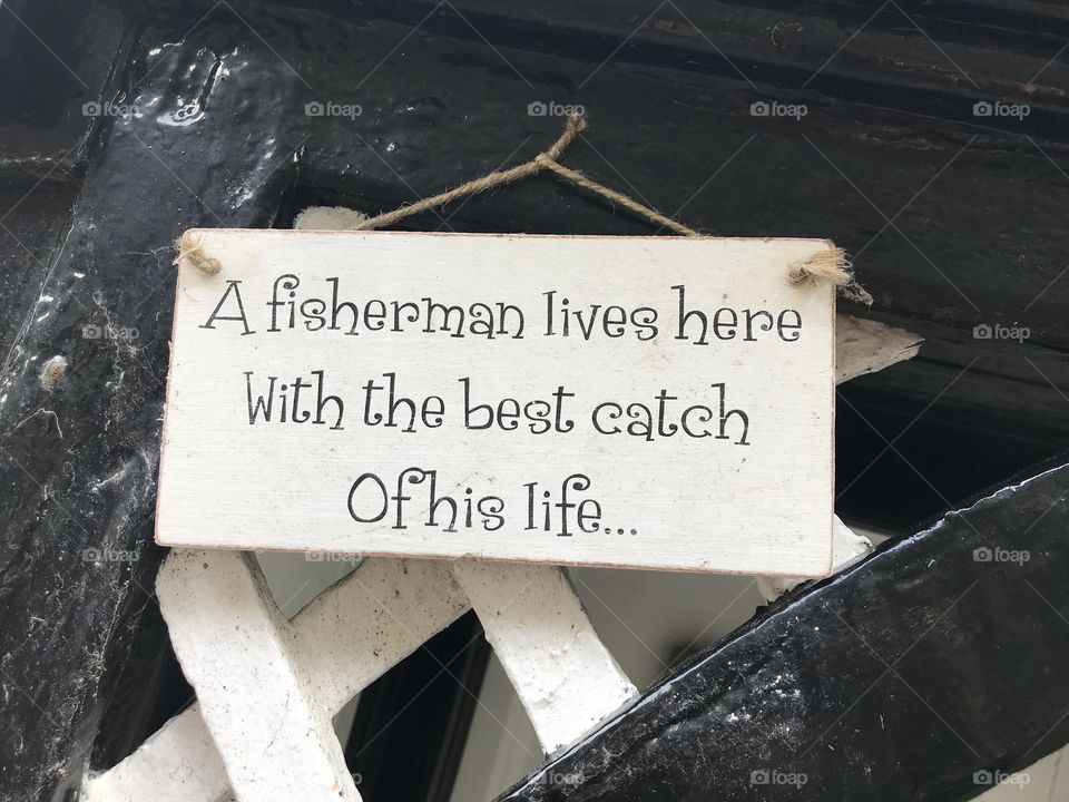 This plaque outside a fisherman’s house says it all for me, l think these words represent identity of true love, respect and wit.