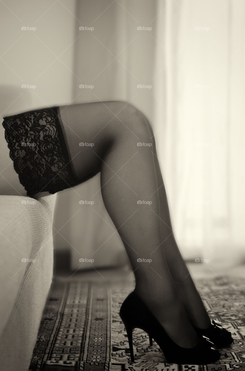 legs on the sofa in the living room