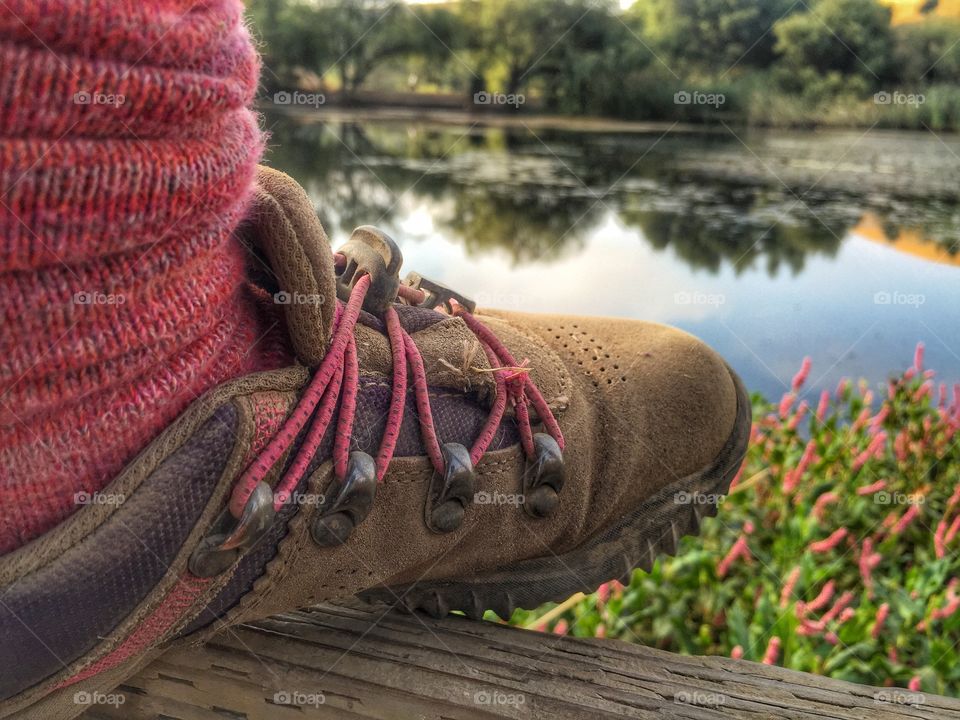 Hiking shoe overlooking the pond.