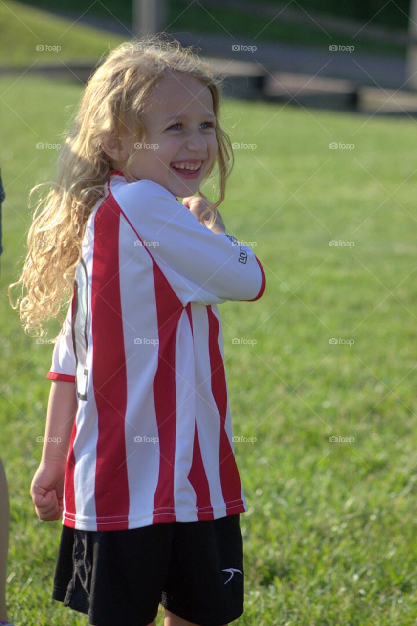 Little cute girl in sports clothing