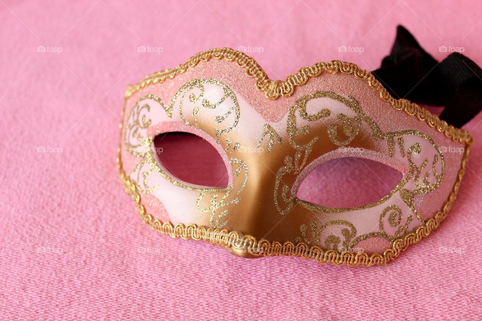 Gold and Pink mask on pink background