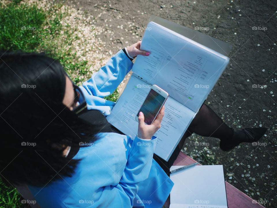 Female hands using smartphone for business 