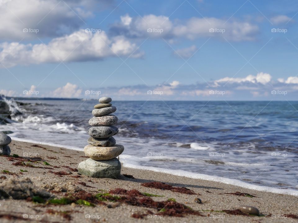 Stacked stones at shoreline