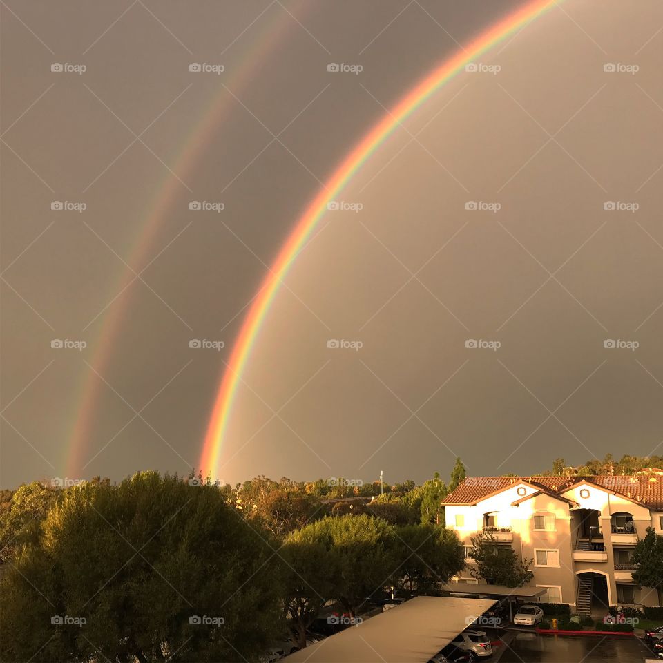 A double rainbow in the distance seen from our balcony in the morning just after a storm!